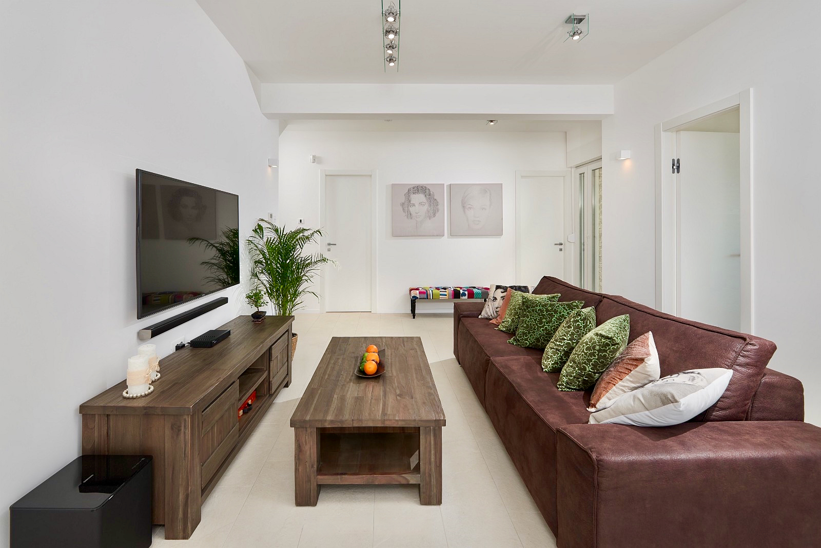 Middle lounge area with large TV and speakers